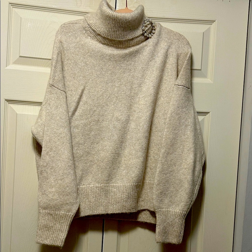 H&M Cream Turtleneck Sweater with decorative brooch